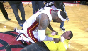 LeBron James bear hugs a fan who hit a half-court shot worth $75,000 (VIDEO)